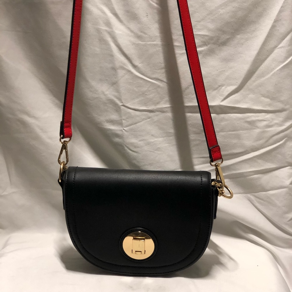 Cross body black bag with red strap